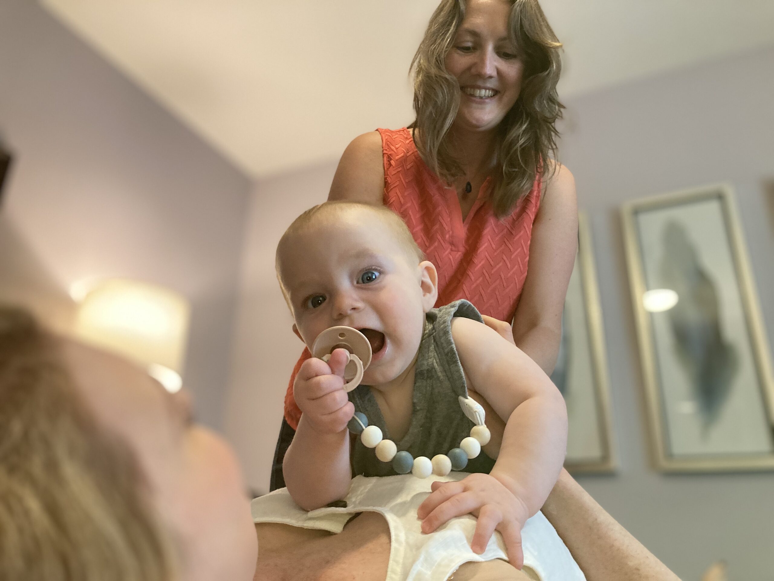 Chiropractor with baby during session